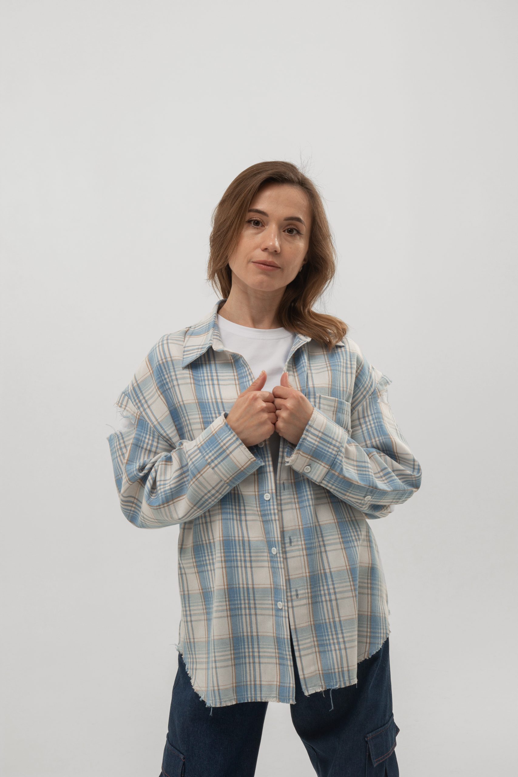 Women's light blue oversized plaid shirt with distressed sleeves